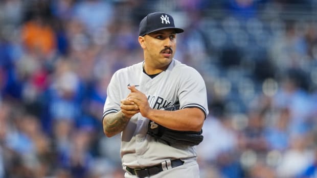 New York Yankees SP Nestor Cortes warms baseball on mound